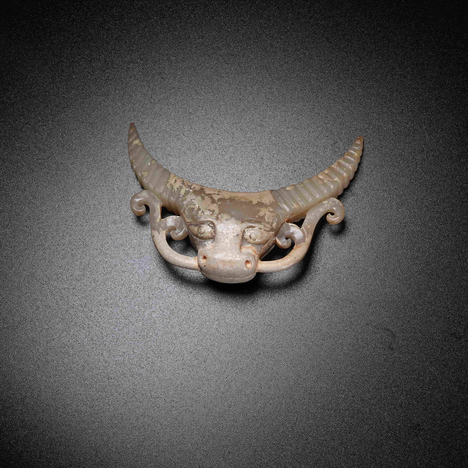 A ARCHAIC JADE OX PENDANT: Archaic Jade Ox Pendant