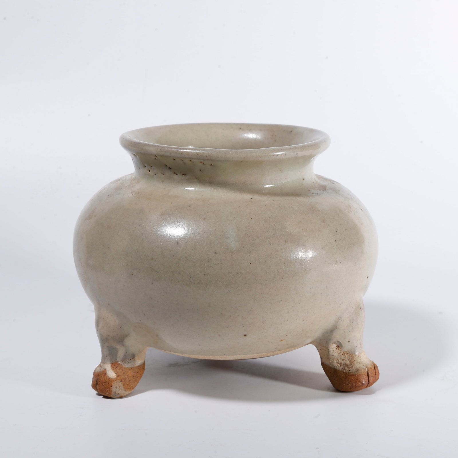 A CELADON THREE?LEGGED CENSER: Celadon three?legged censer