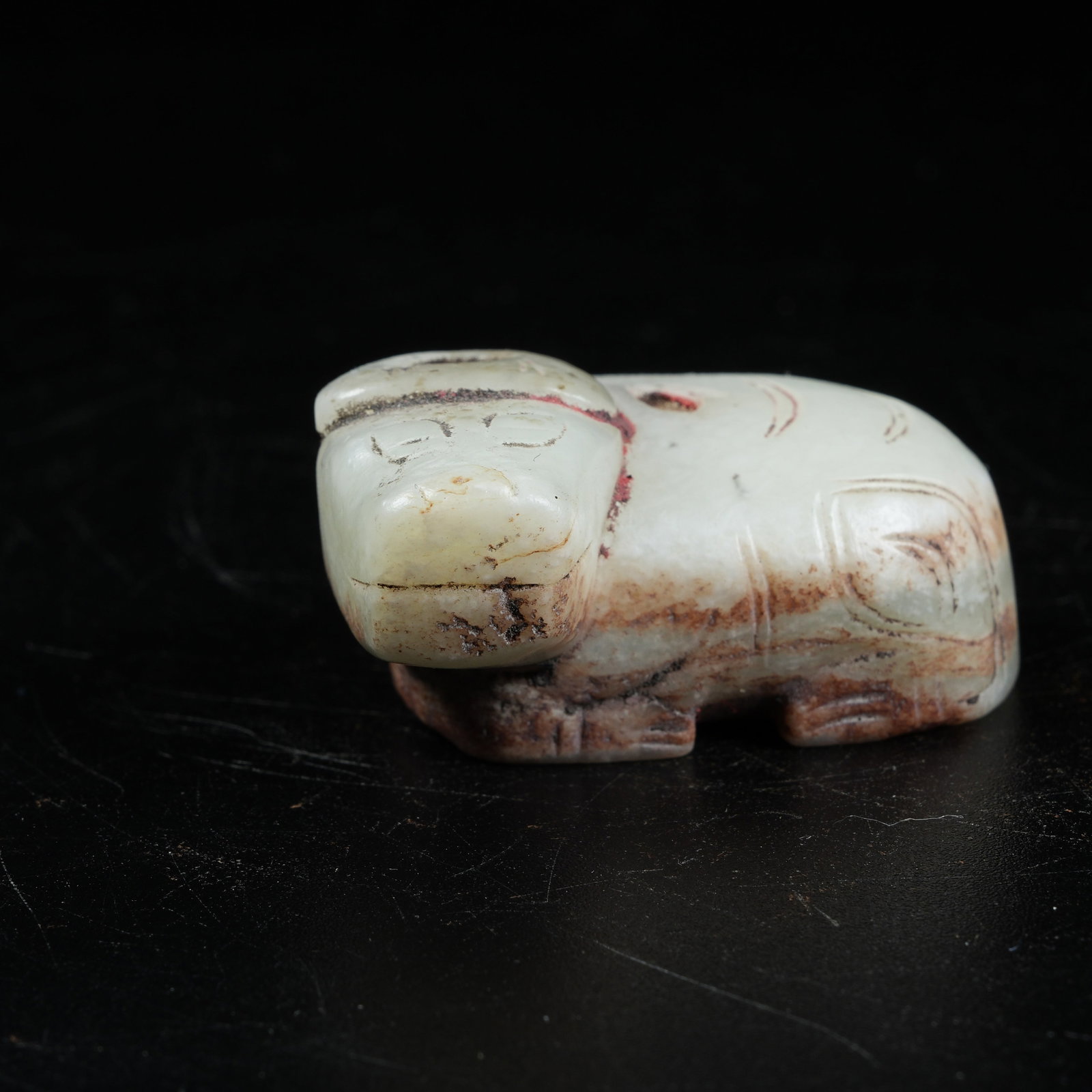 A ANCIENT JADE RECLINING OX ORNAMENT: Ancient Jade Reclining Ox Ornament