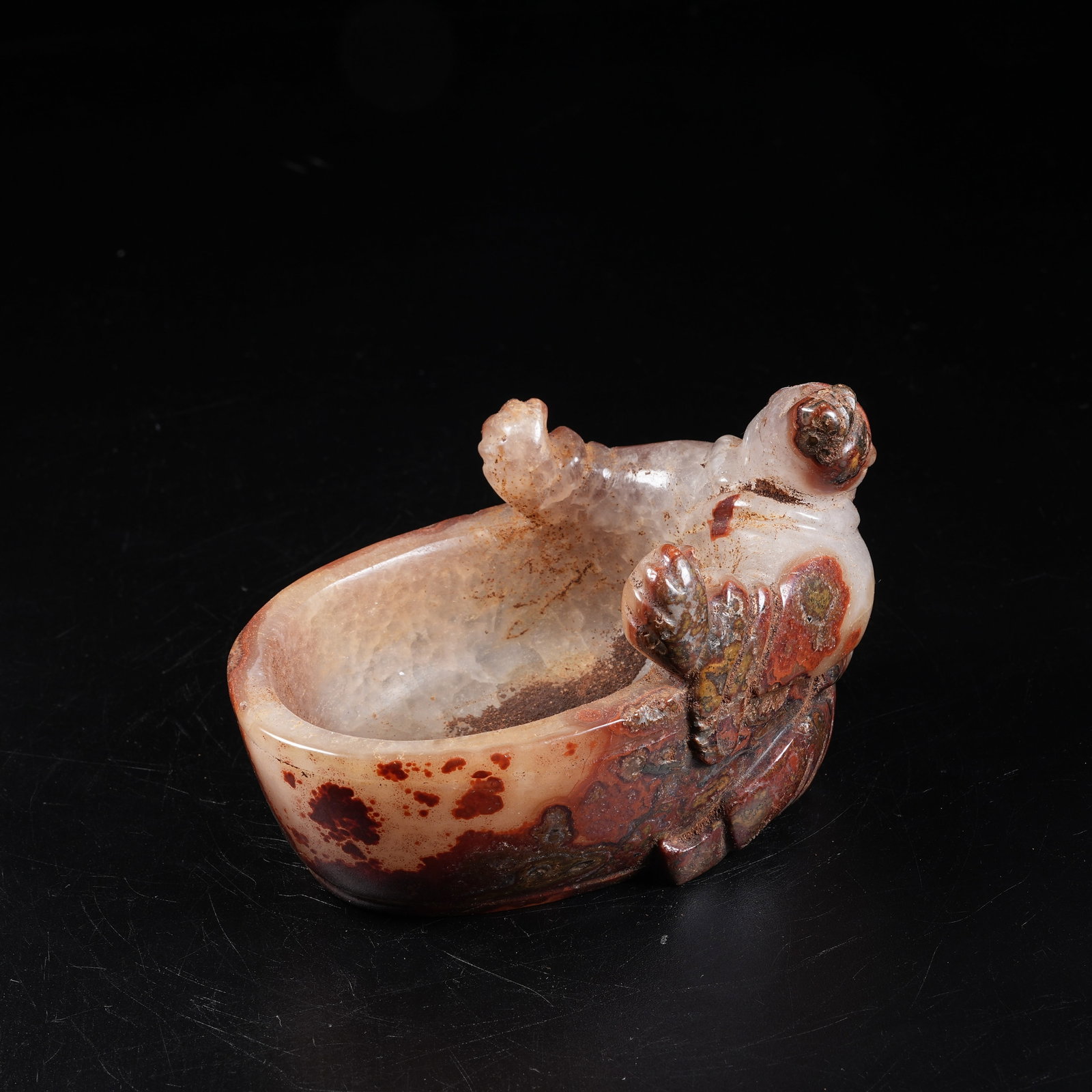 A WARRING STATES RED AGATE WASHER CARVED WITH DIVINE FIGURE (1 of 8)