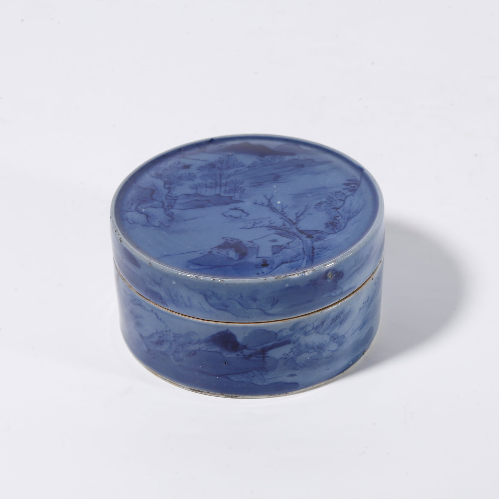 A SNUFF BOTTLE WITH BLUE?AND?WHITE LANDSCAPE MOTIF ON BLUE GROUND: Snuff bottle with blue?and?white landscape motif on blue ground