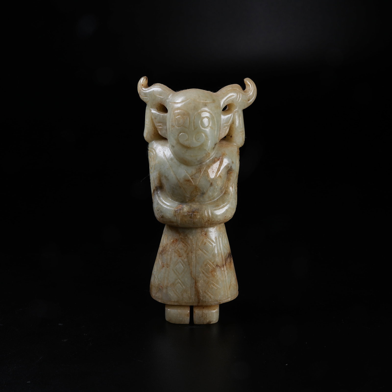 A STANDING ARCHAIC JADE DEITY ORNAMENT: Standing Archaic Jade Deity Ornament