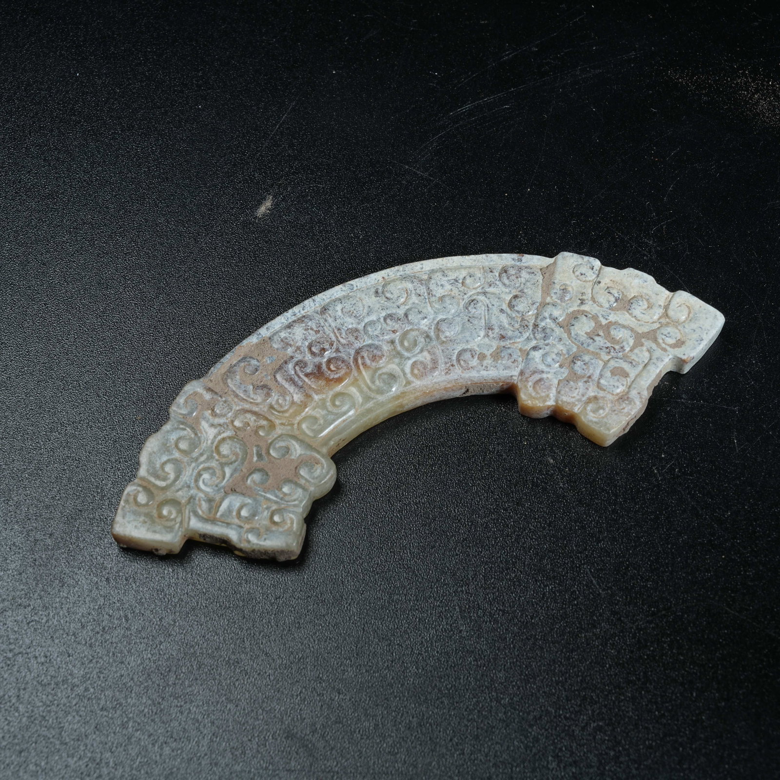 A ANCIENT JADE ASSEMBLED PENDANT SET CARVED WITH HOOKED CLOUD PATTERNS: Ancient Jade Assembled Pendant Set Carved with Hooked Cloud Patterns
