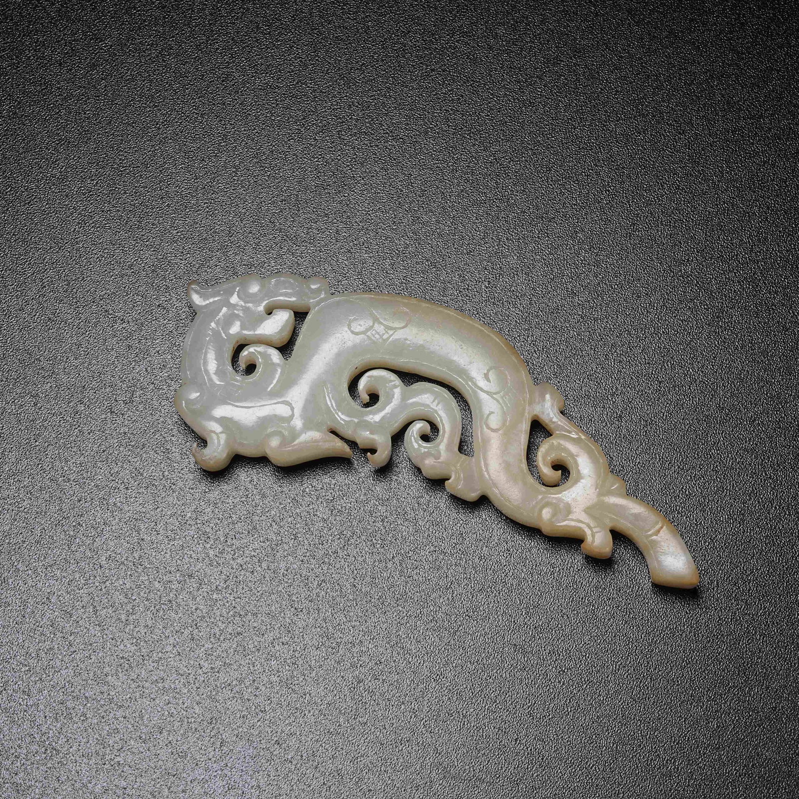 A ARCHAIC JADE S-SHAPED DRAGON PENDANT: Archaic Jade S-shaped Dragon Pendant