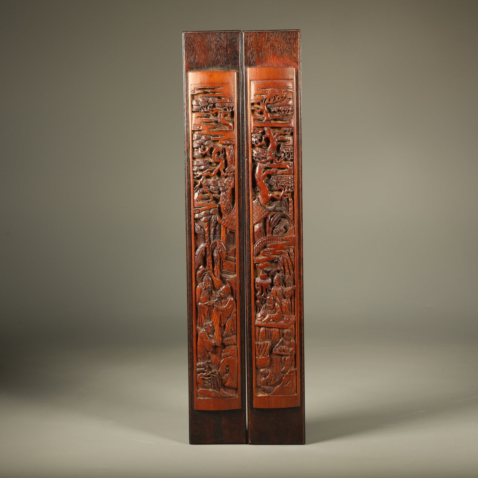 A PAIR OF SANDALWOOD PAPER WEIGHTS INLAID WITH BAMBOO?CARVED LANDSCAPE AND FIGURE SCENES: Pair of Sandalwood Paper Weights Inlaid with Bamboo?carved Landscape and Figure Scenes