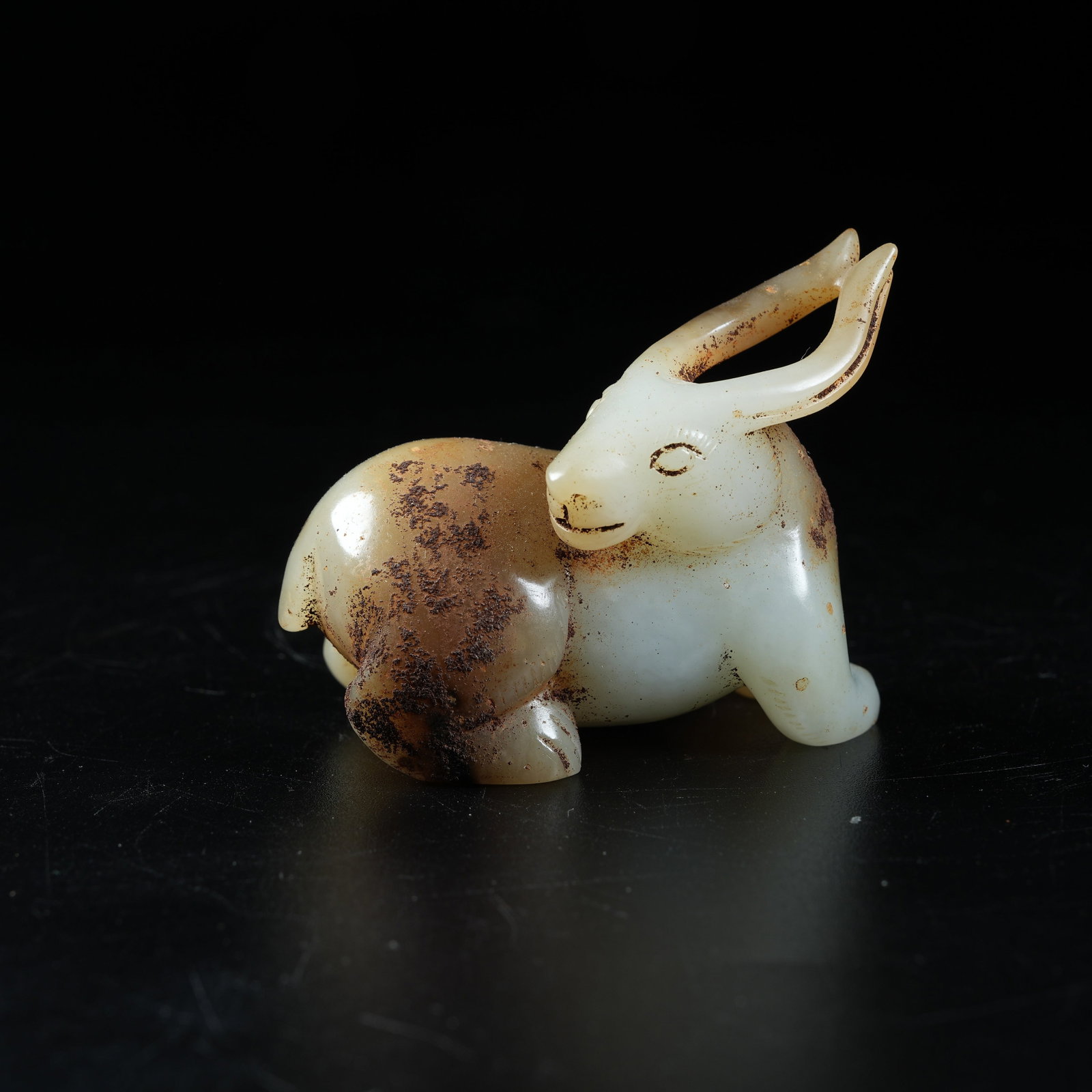 A ANCIENT JADE RECLINING DEER ORNAMENT: Ancient Jade Reclining Deer Ornament