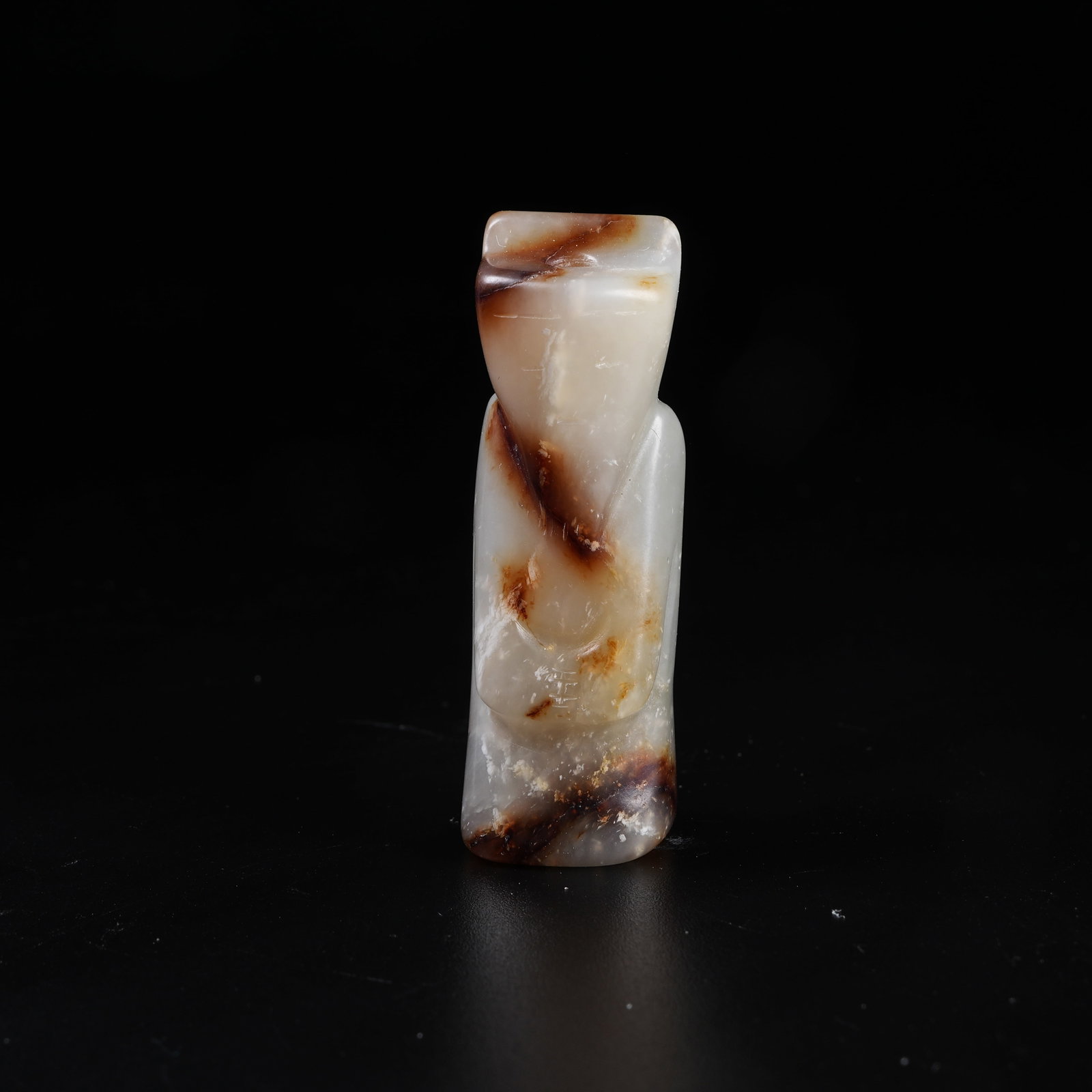 A ARCHAIC JADE WENGZHONG FIGURINE: Archaic Jade Wengzhong Figurine