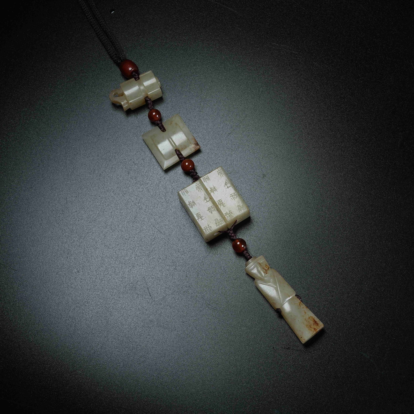 A SET OF ANCIENT JADE FOUR AUSPICIOUS TREASURES PENDANTS (1 of 10)
