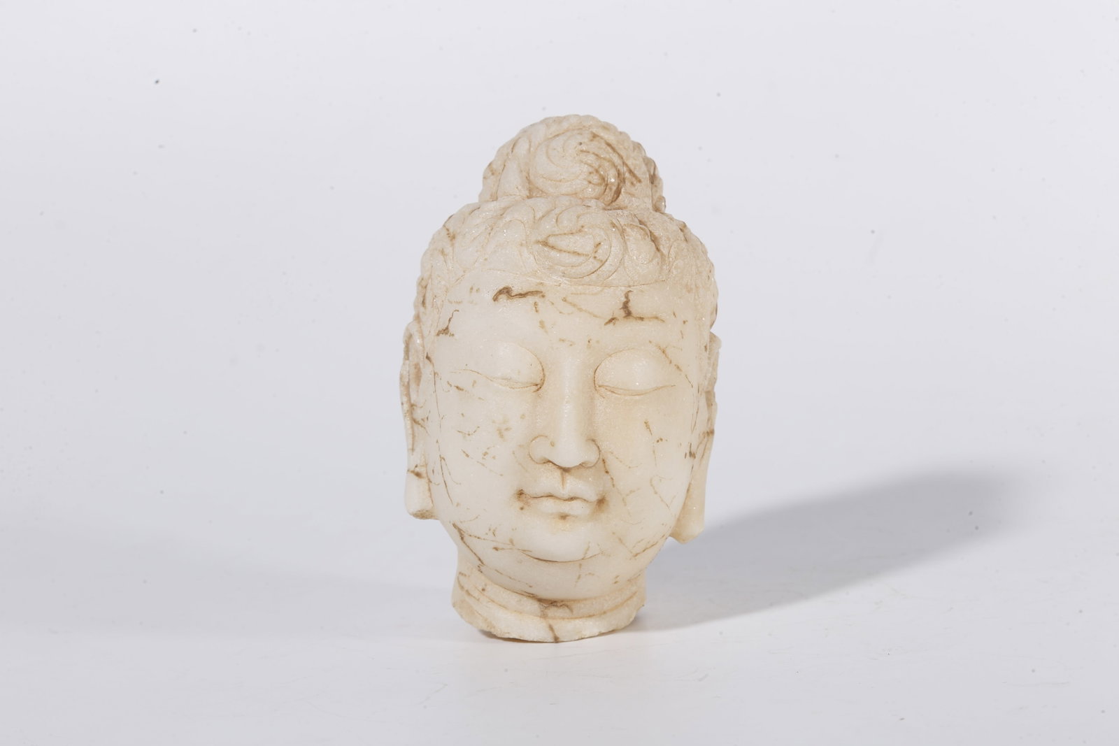 A WHITE MARBLE BUDDHA HEAD (SET) - 2