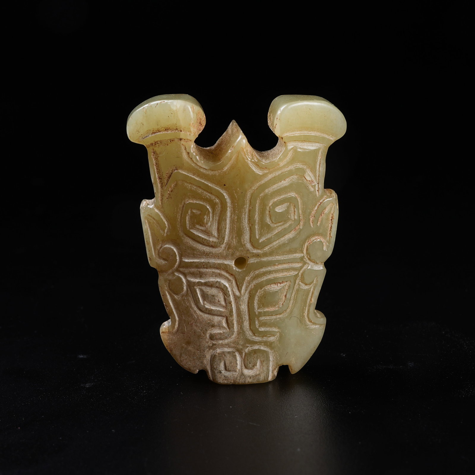 A ARCHAIC JADE PENDANT WITH DEITY FACE: Archaic Jade Pendant with Deity Face