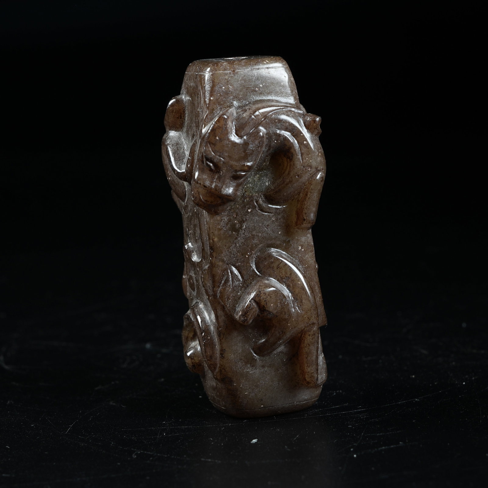 A ANCIENT JADE CYLINDRICAL PENDANT CARVED WITH CHI DRAGON PATTERNS (1 of 9)
