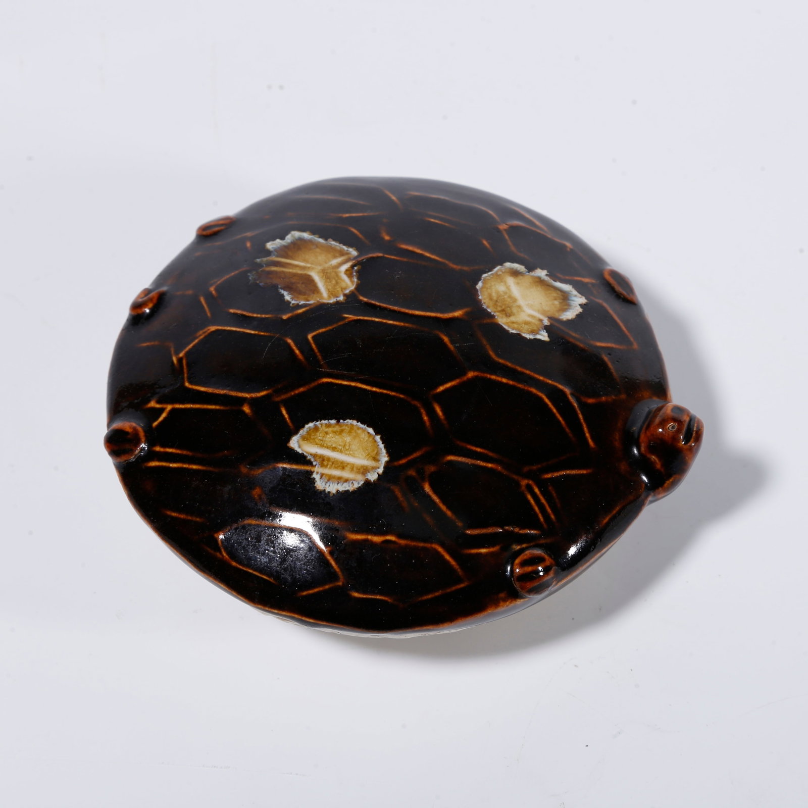 A DING WARE BROWN?PAINTED TURTLE?FORM ORNAMENT: Ding ware brown?painted turtle?form ornament