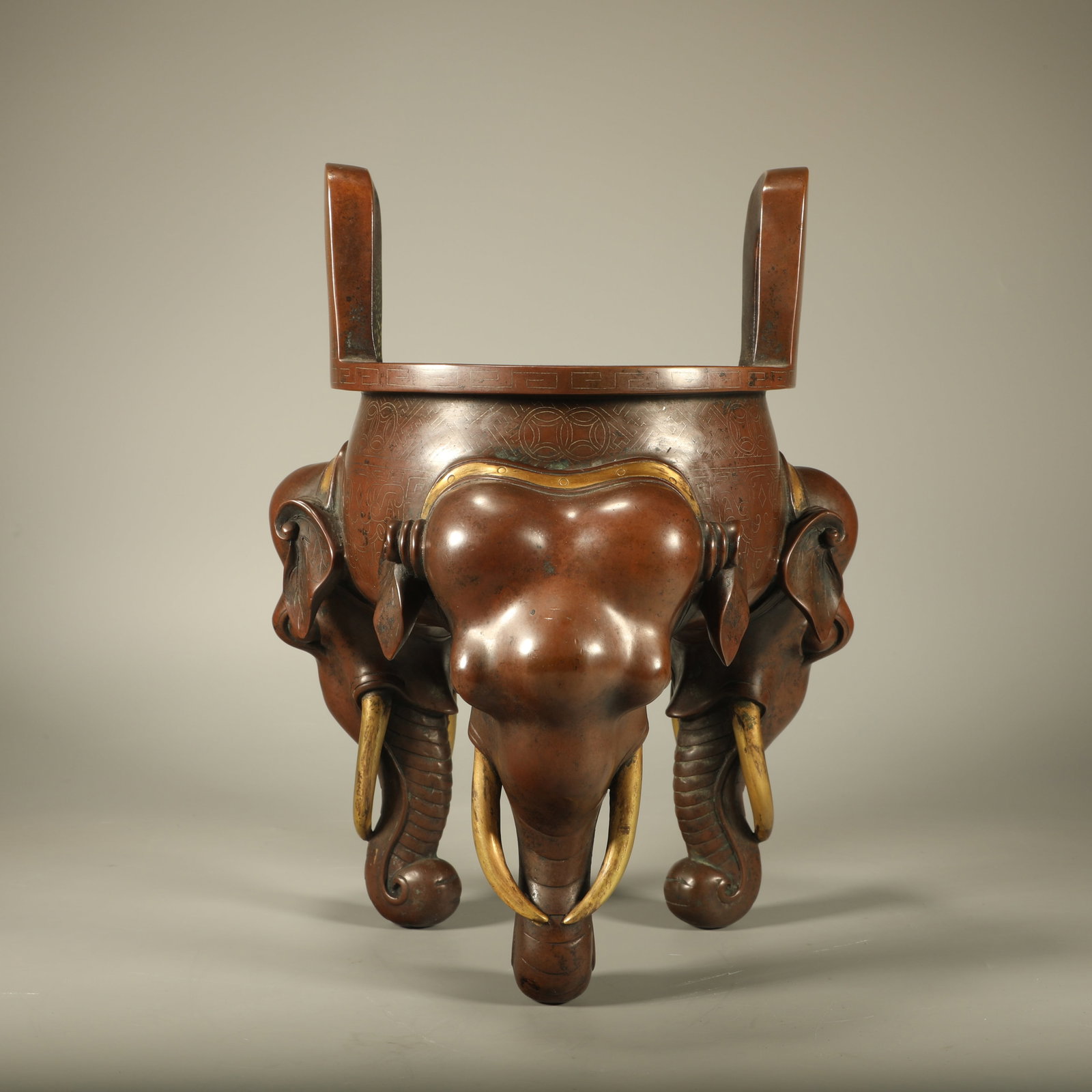A GILT?BRONZE CENSER WITH SILVER?WIRE INLAY AND ELEPHANT?LEG SUPPORTS: Gilt?bronze Censer with Silver?wire Inlay and Elephant?leg Supports