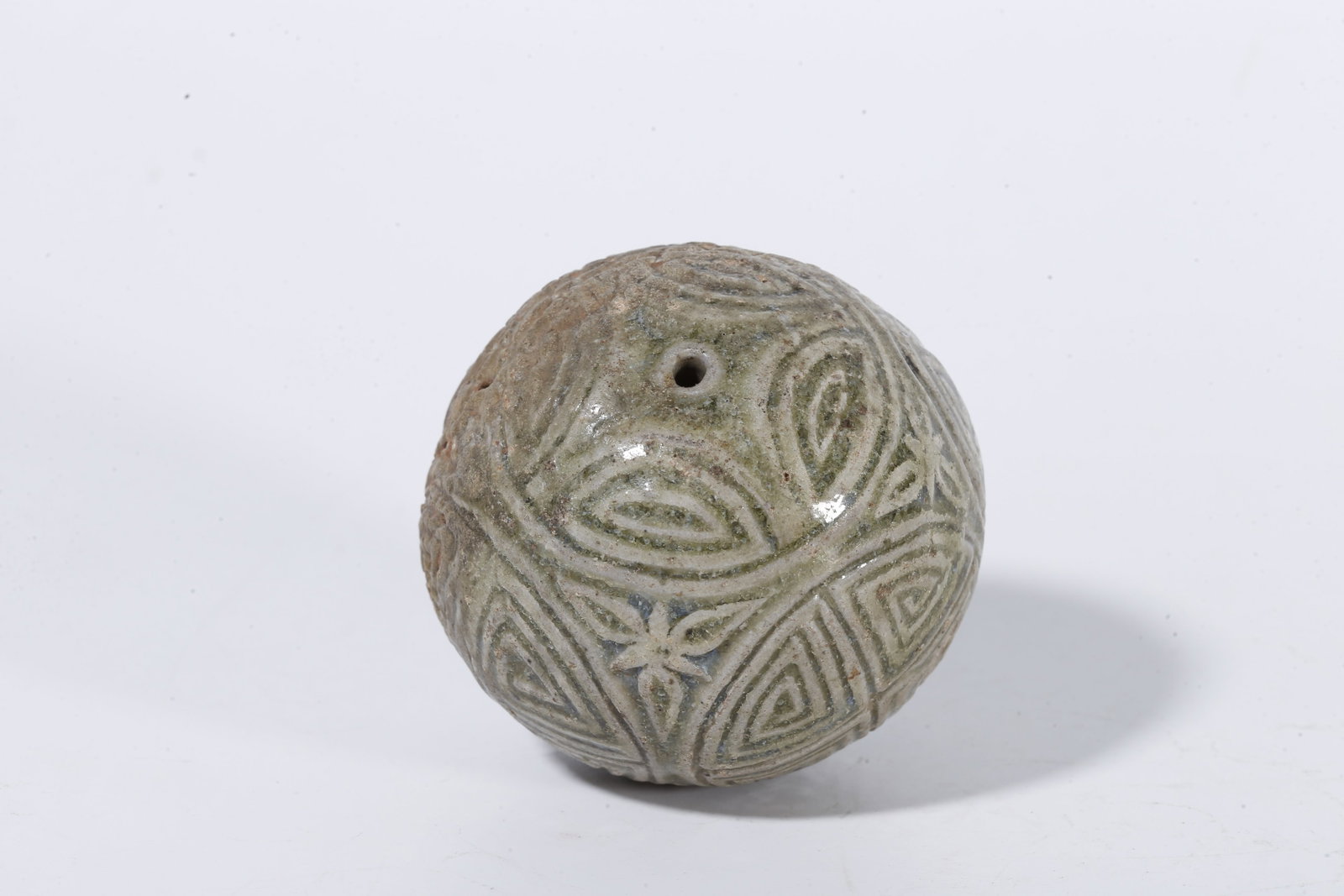 A CELADON SPHERE WITH SWASTIKA PATTERN - 6