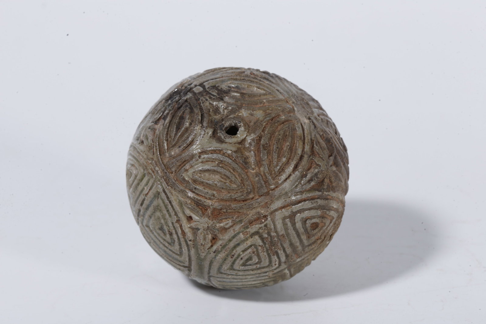 A CELADON SPHERE WITH SWASTIKA PATTERN - 7