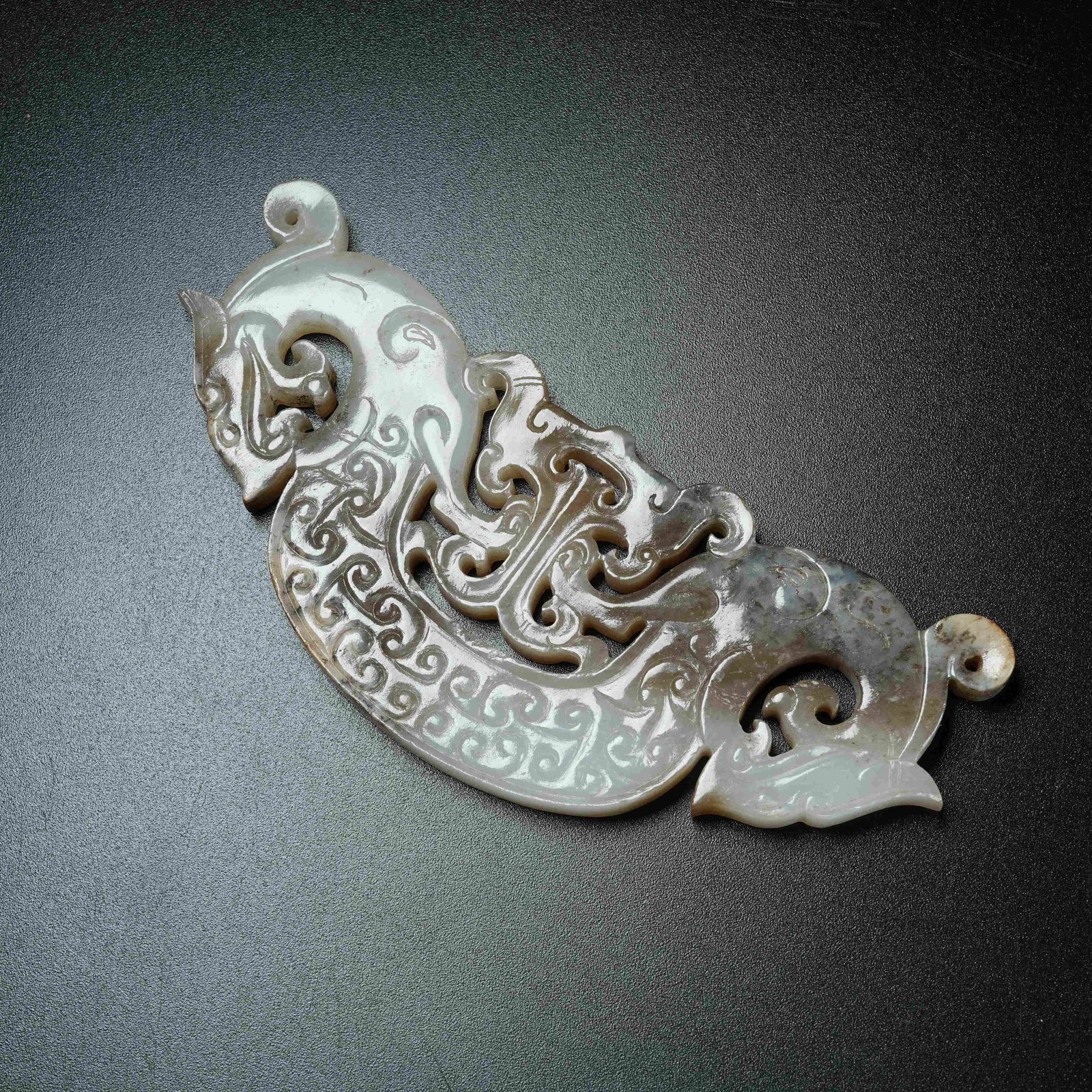 A ANCIENT JADE S-SHAPED DRAGON PENDANT: Ancient Jade S-shaped Dragon Pendant
