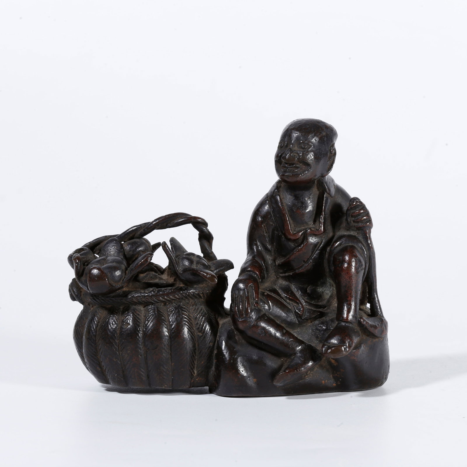 A BRONZE FIGURE PAPERWEIGHT: Bronze figure paperweight