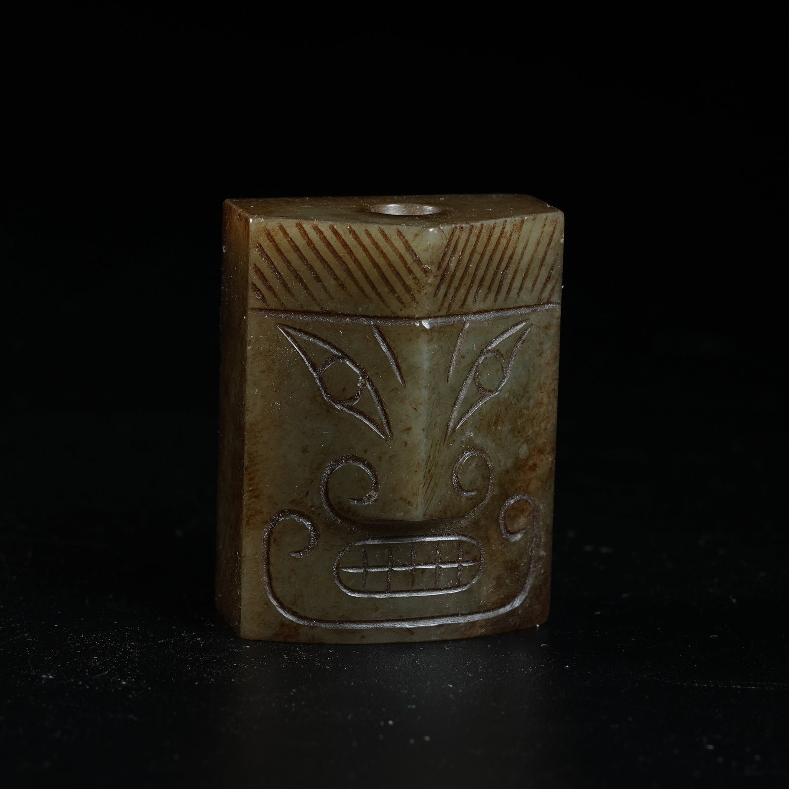 A ANCIENT JADE SEAL CARVED WITH DIVINE HUMAN FACE MOTIFS (1 of 6)