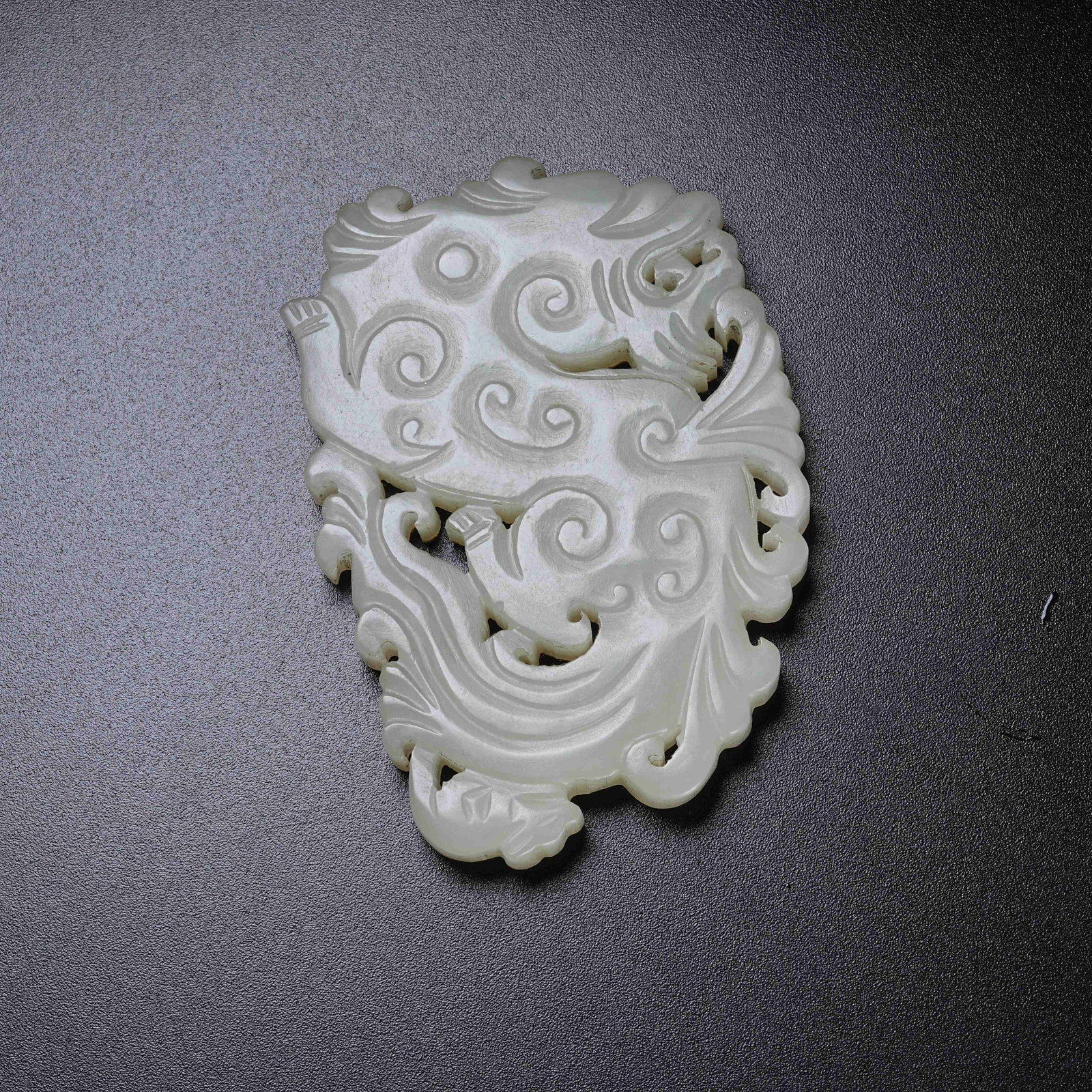 A HETIAN JADE MAKARA PENDANT: Hetian Jade Makara Pendant