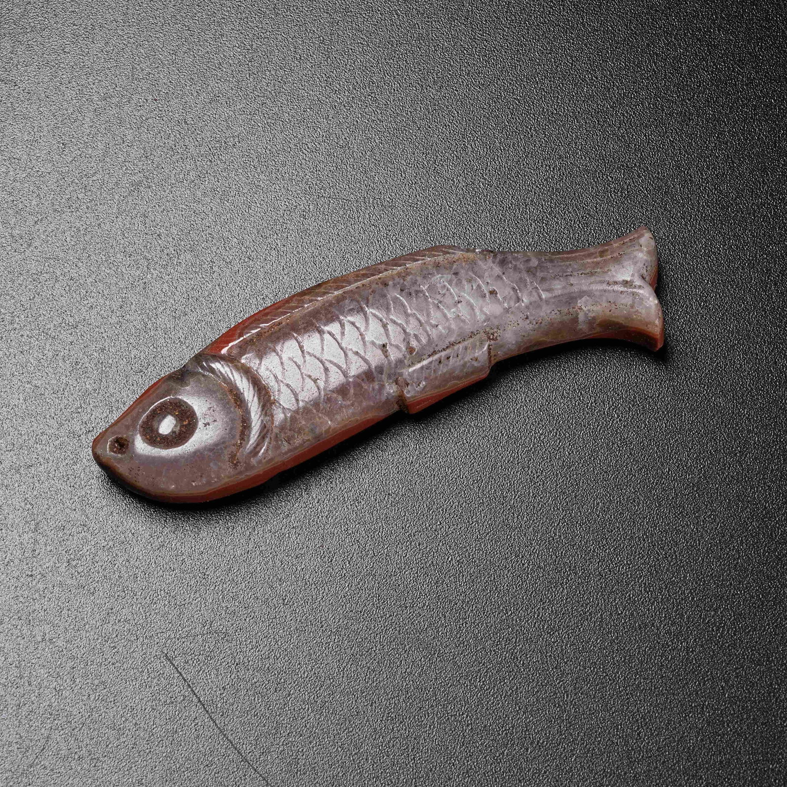 A WARRING STATES RED AGATE FISH PENDANT (1 of 9)