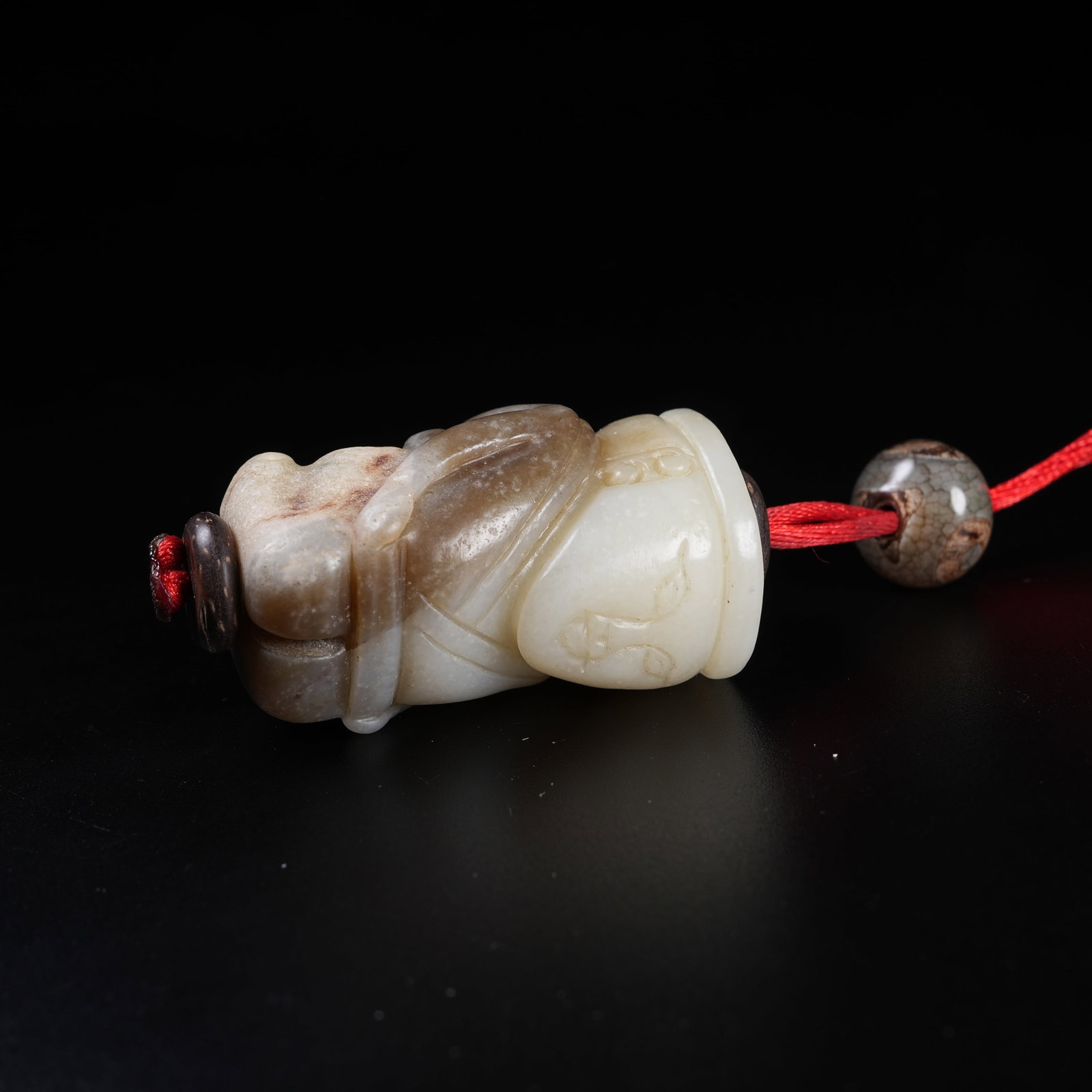 A ARCHAIC JADE KNEELING HUMAN FIGURINE: Archaic Jade Kneeling Human Figurine