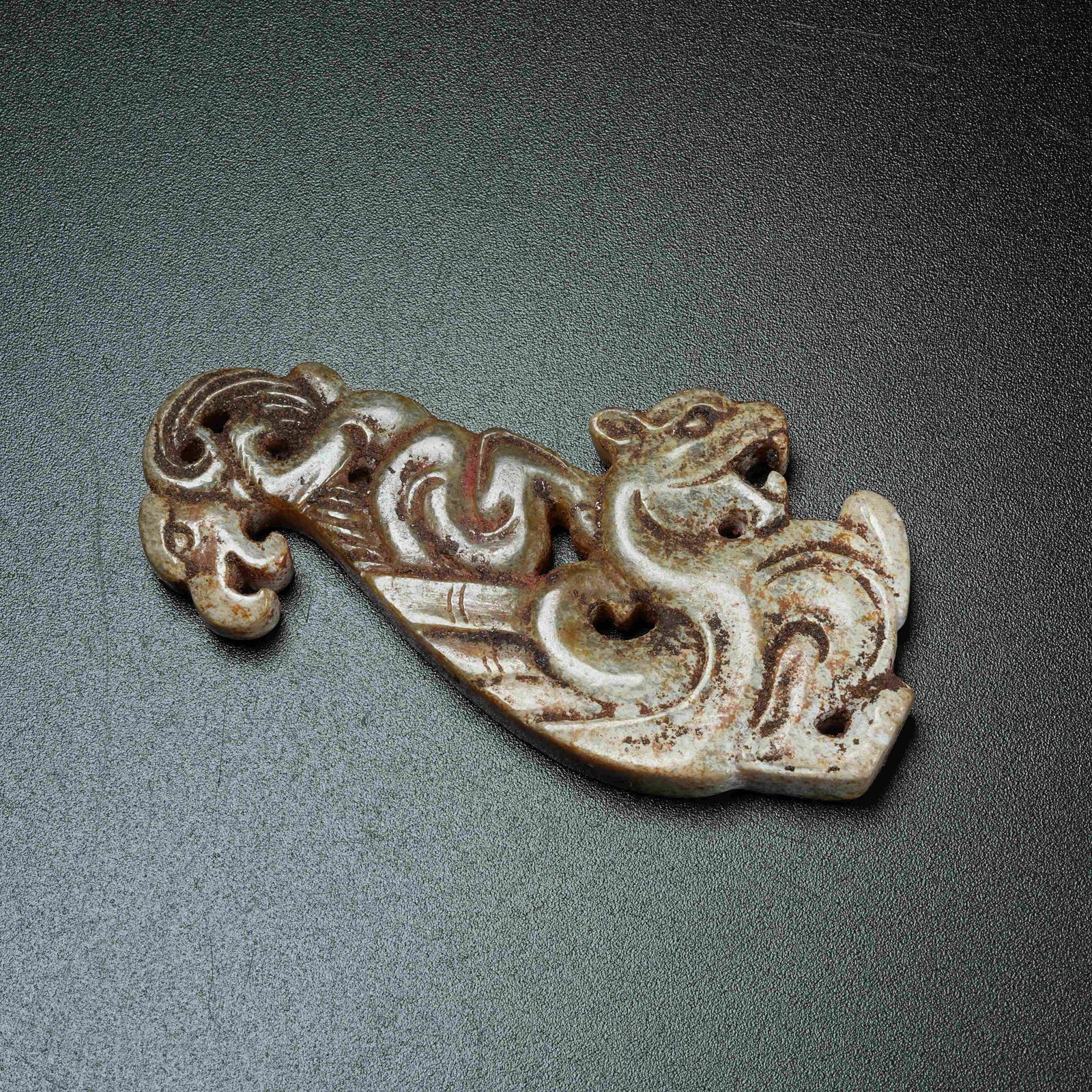 A ANCIENT JADE AUSPICIOUS BEAST PENDANT: Ancient Jade Auspicious Beast Pendant