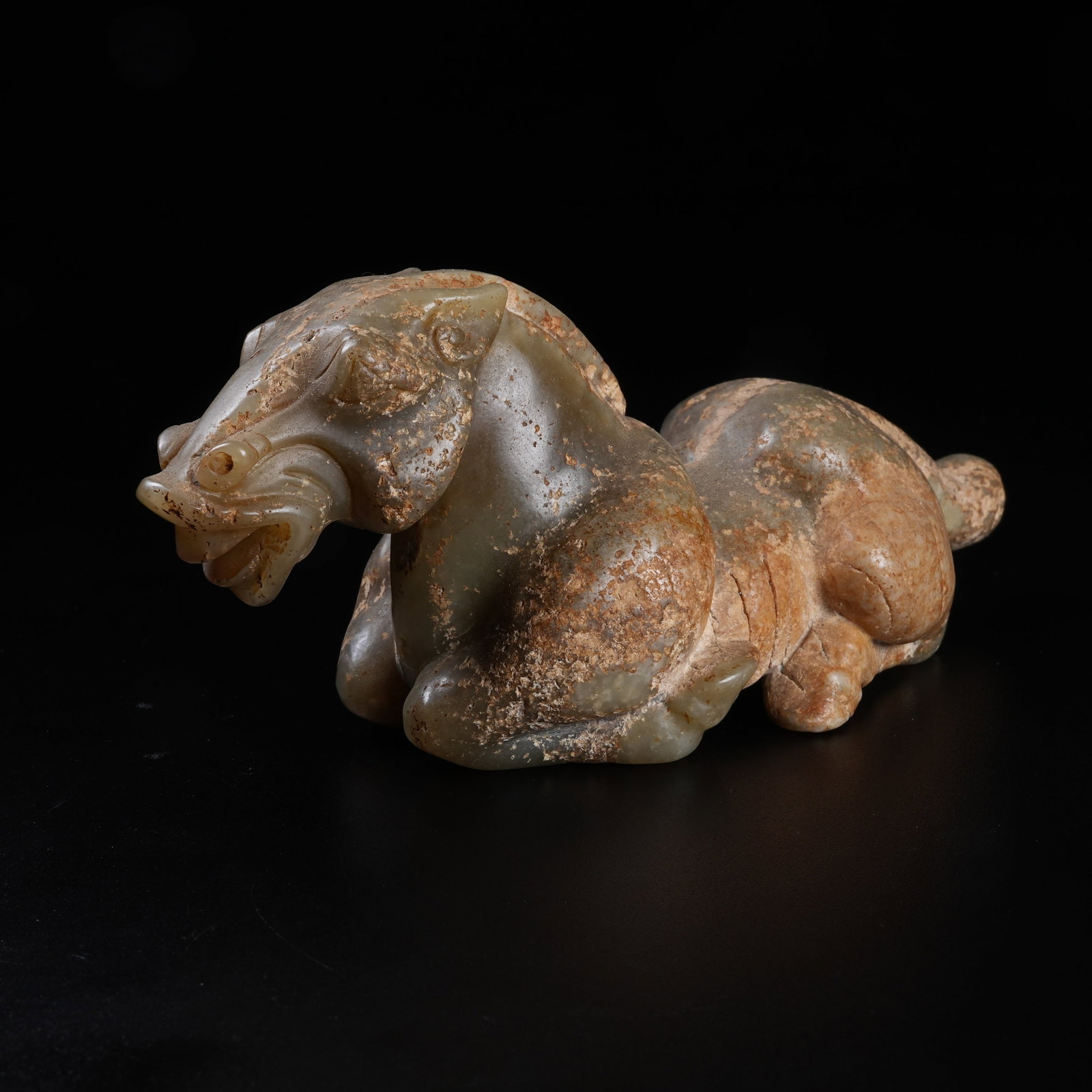 A ARCHAIC JADE RECUMBENT HORSE ORNAMENT: Archaic Jade Recumbent Horse Ornament