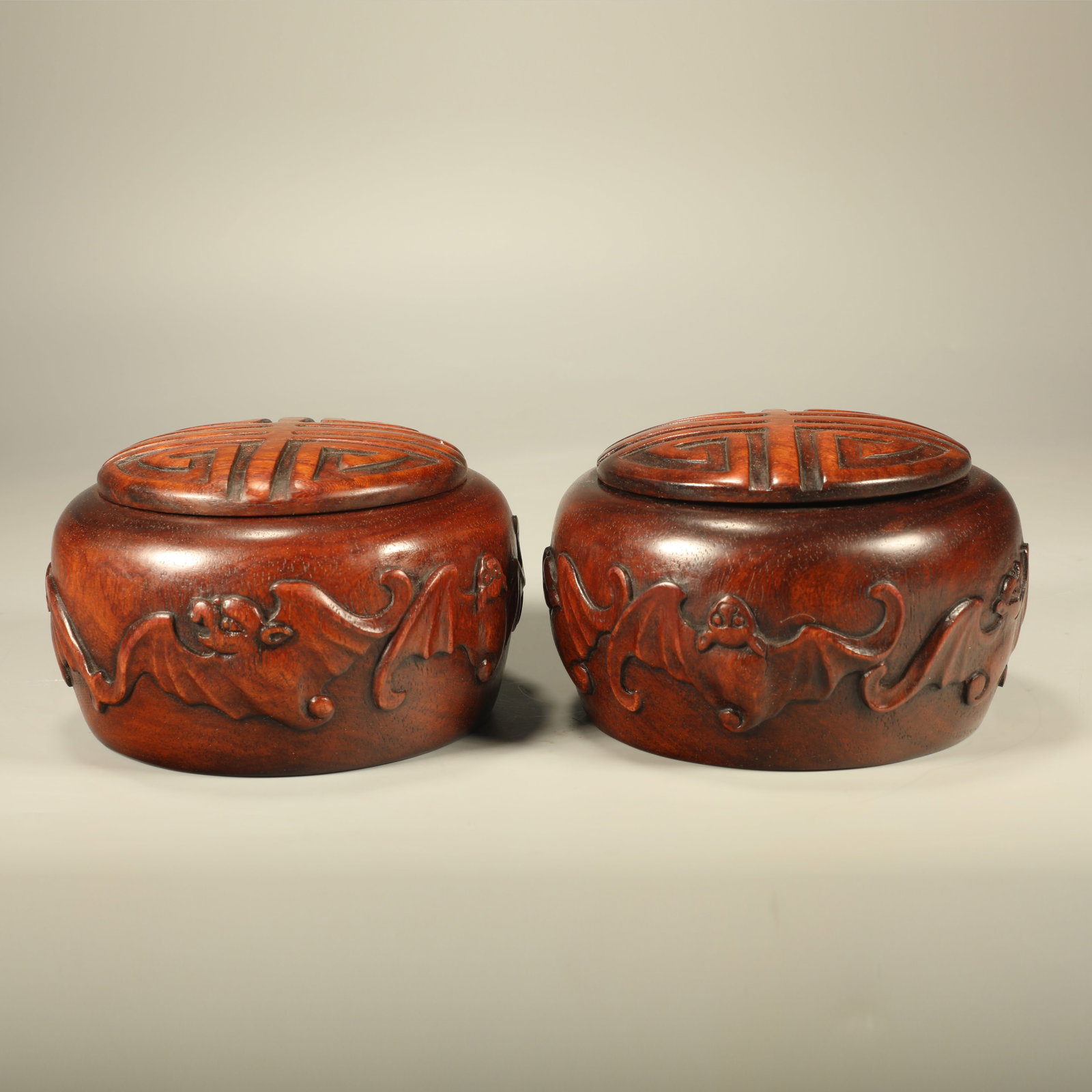 A PAIR OF HUANGHUALI GO JARS CARVED WITH FORTUNE?LONGEVITY PATTERNS: Pair of Huanghuali Go Jars Carved with Fortune?longevity Patterns