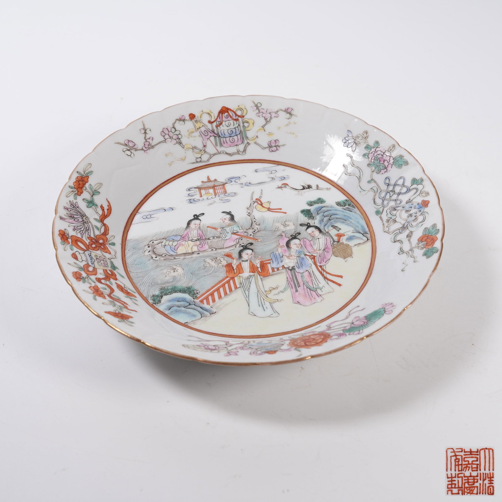 A FAMILLE ROSE FLORAL RIM PLATE WITH IMMORTAL MAIDENS: Famille Rose Floral Rim Plate with Immortal Maidens