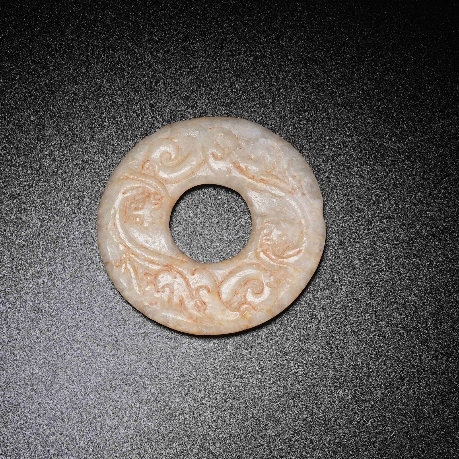 A ARCHAIC JADE BI WITH BEAST MASK PATTERN: Archaic Jade Bi with Beast Mask Pattern