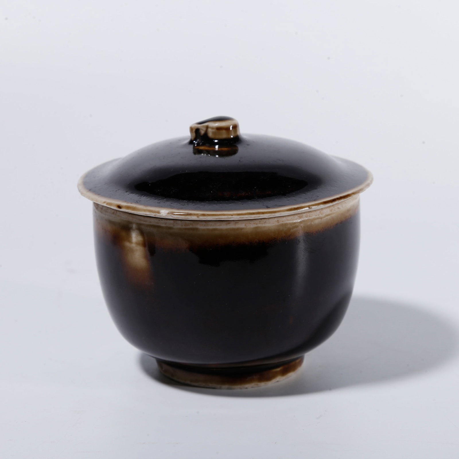 A BLACK DING COVERED JAR (1 of 9)