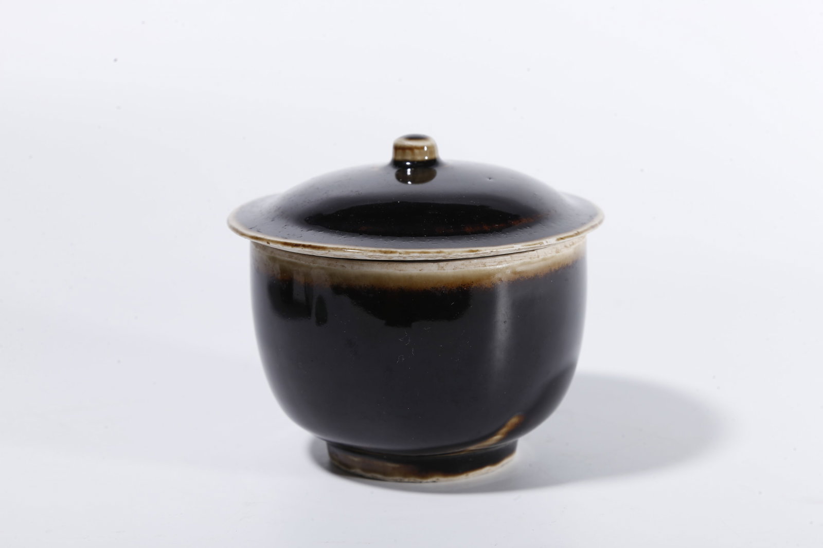 A BLACK DING COVERED JAR - 2