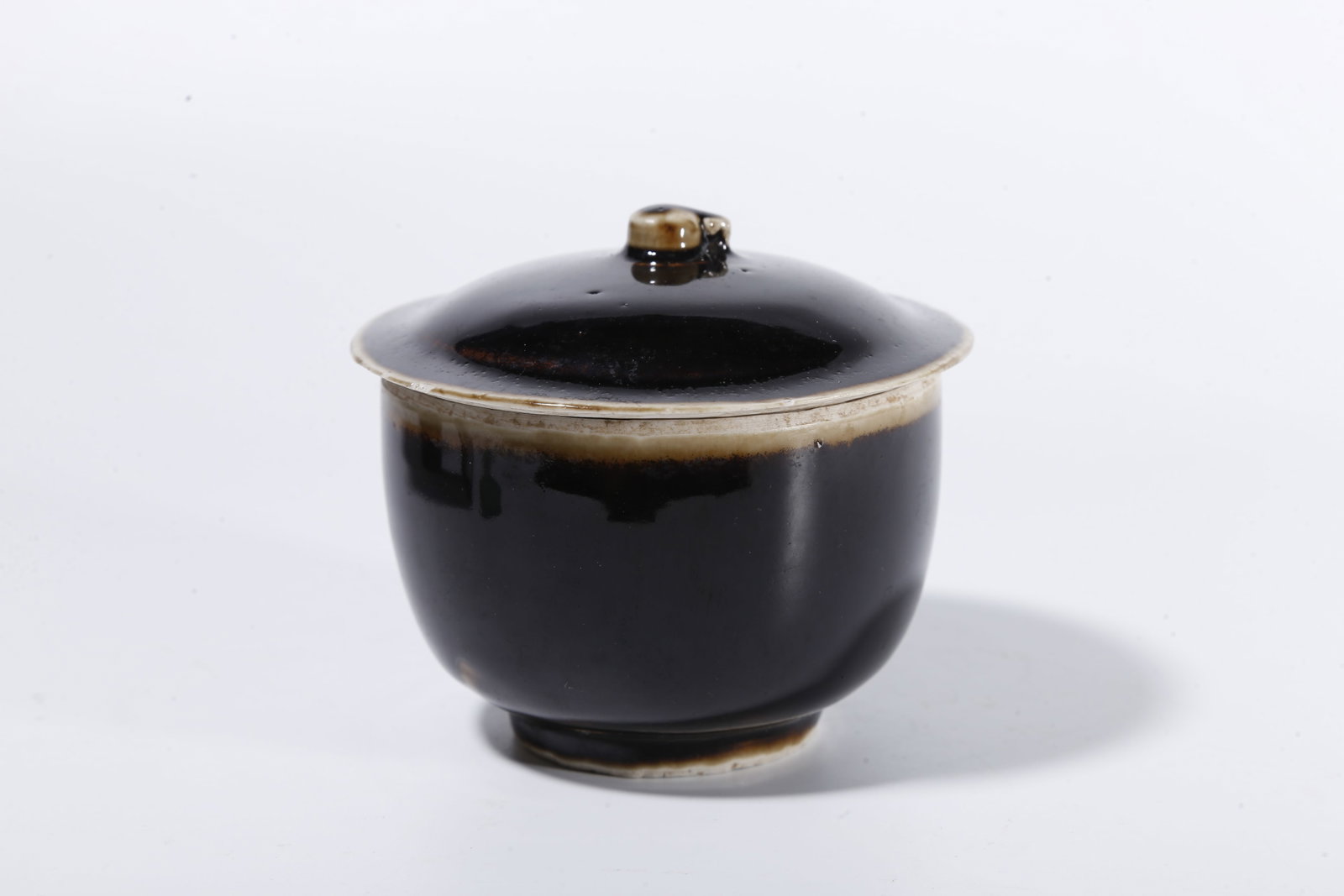 A BLACK DING COVERED JAR - 3