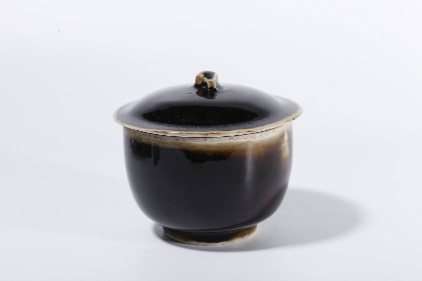 A BLACK DING COVERED JAR - 4