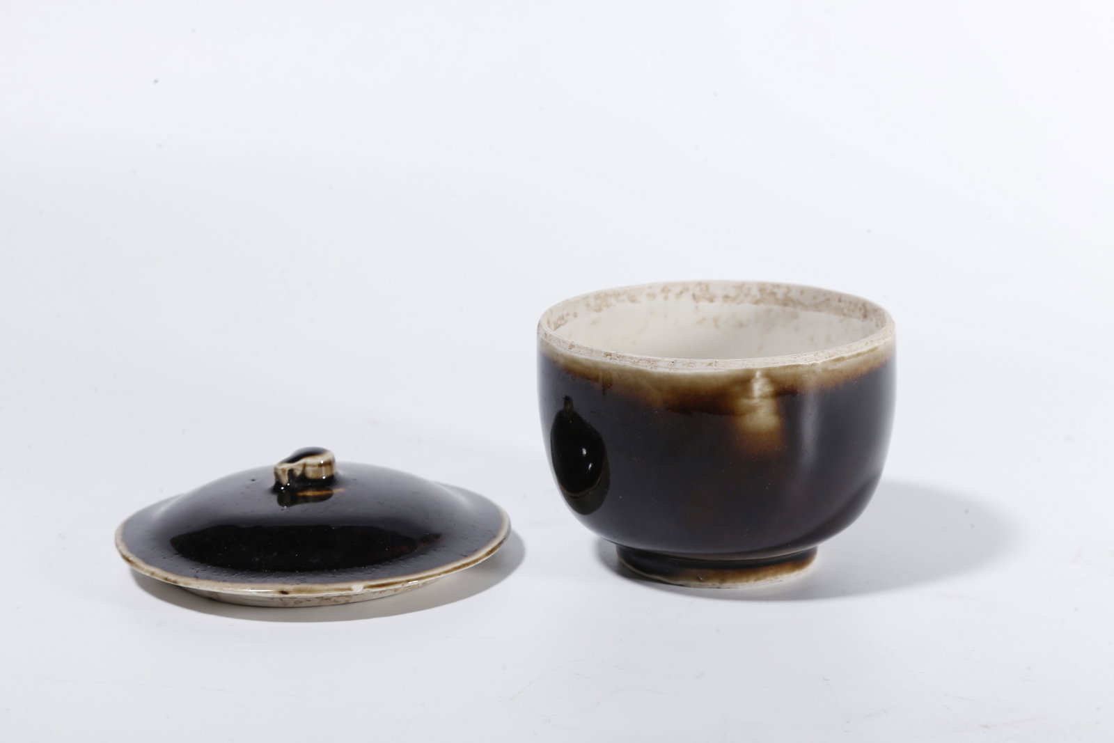 A BLACK DING COVERED JAR - 5