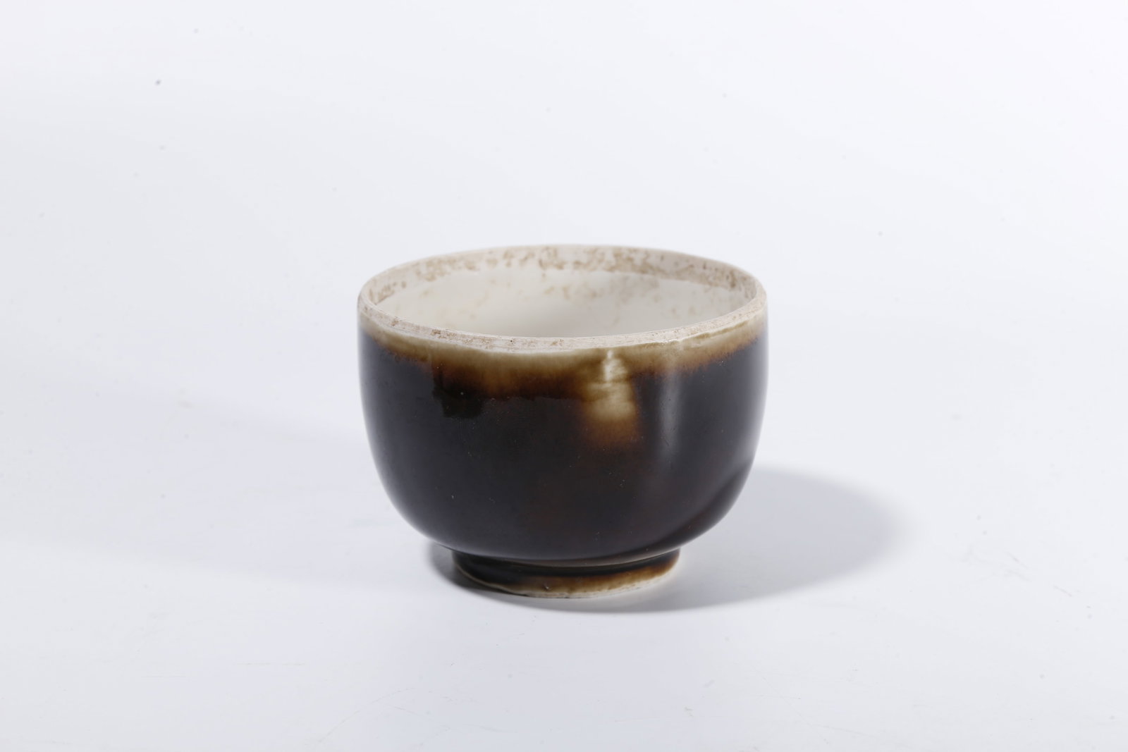 A BLACK DING COVERED JAR - 6