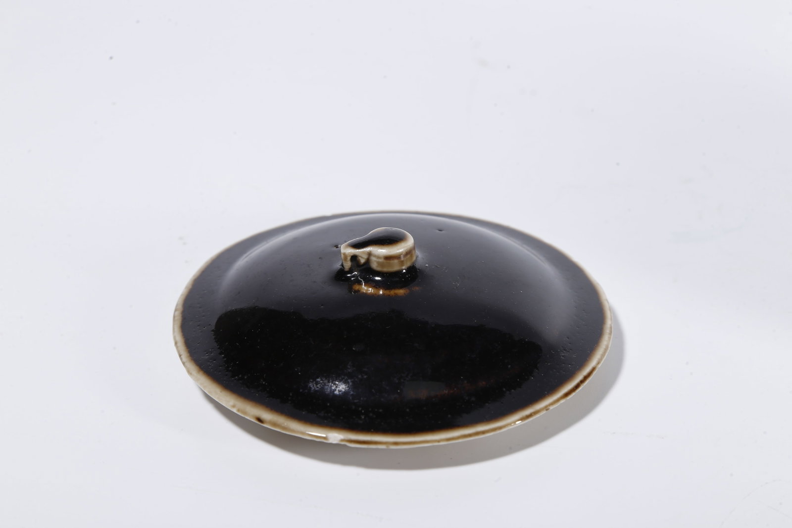 A BLACK DING COVERED JAR - 7