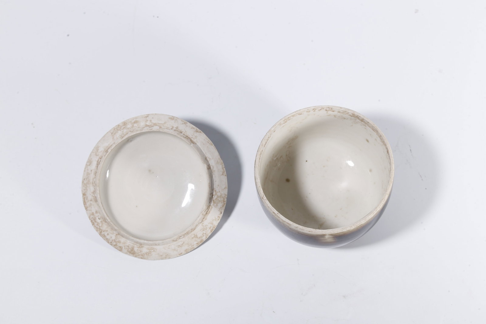 A BLACK DING COVERED JAR - 8