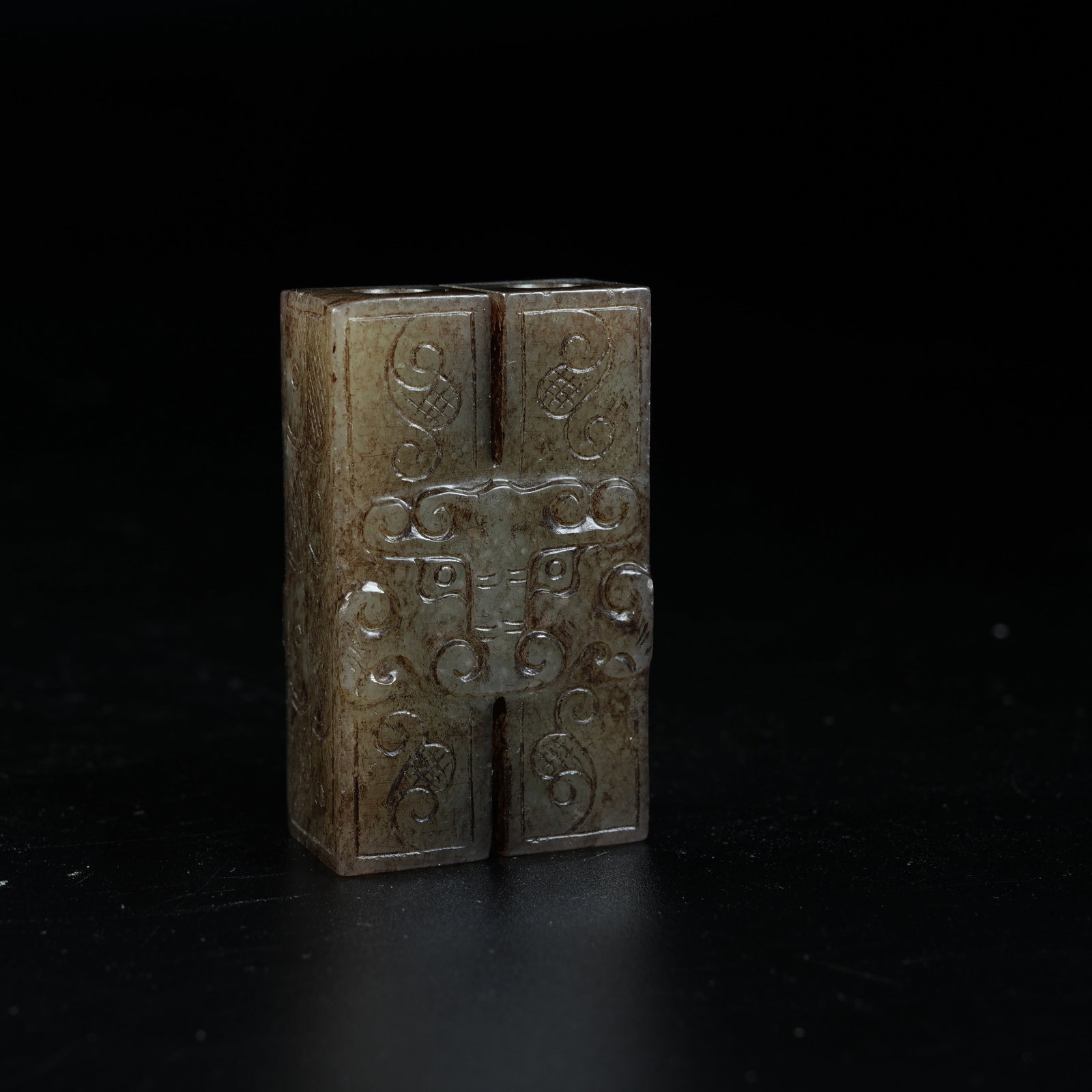 A ANCIENT JADE DOUBLE LINKED CYLINDRICAL PENDANTS CARVED WITH BEAST MASK PATTERNS (1 of 9)