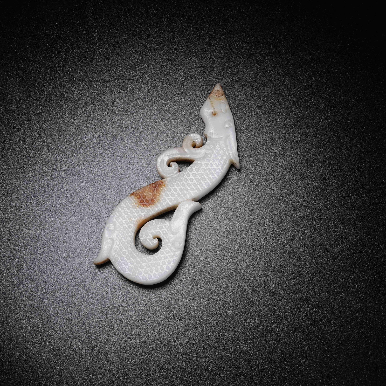 A ARCHAIC JADE S-SHAPED DRAGON PENDANT: Archaic Jade S-shaped Dragon Pendant