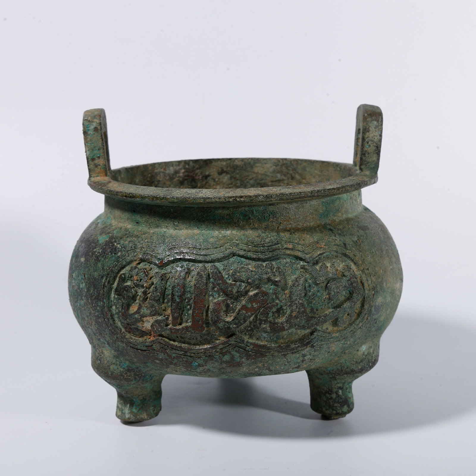 A BRONZE THREE?LEGGED CENSER WITH UPRIGHT EARS (1 of 9)