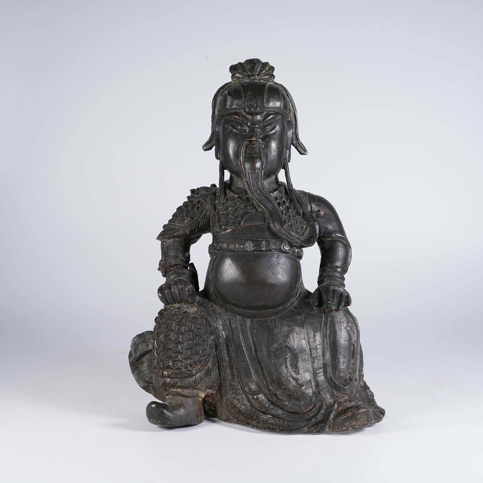 A BRONZE SEATED STATUE OF GUAN GONG: Bronze Seated Statue of Guan Gong