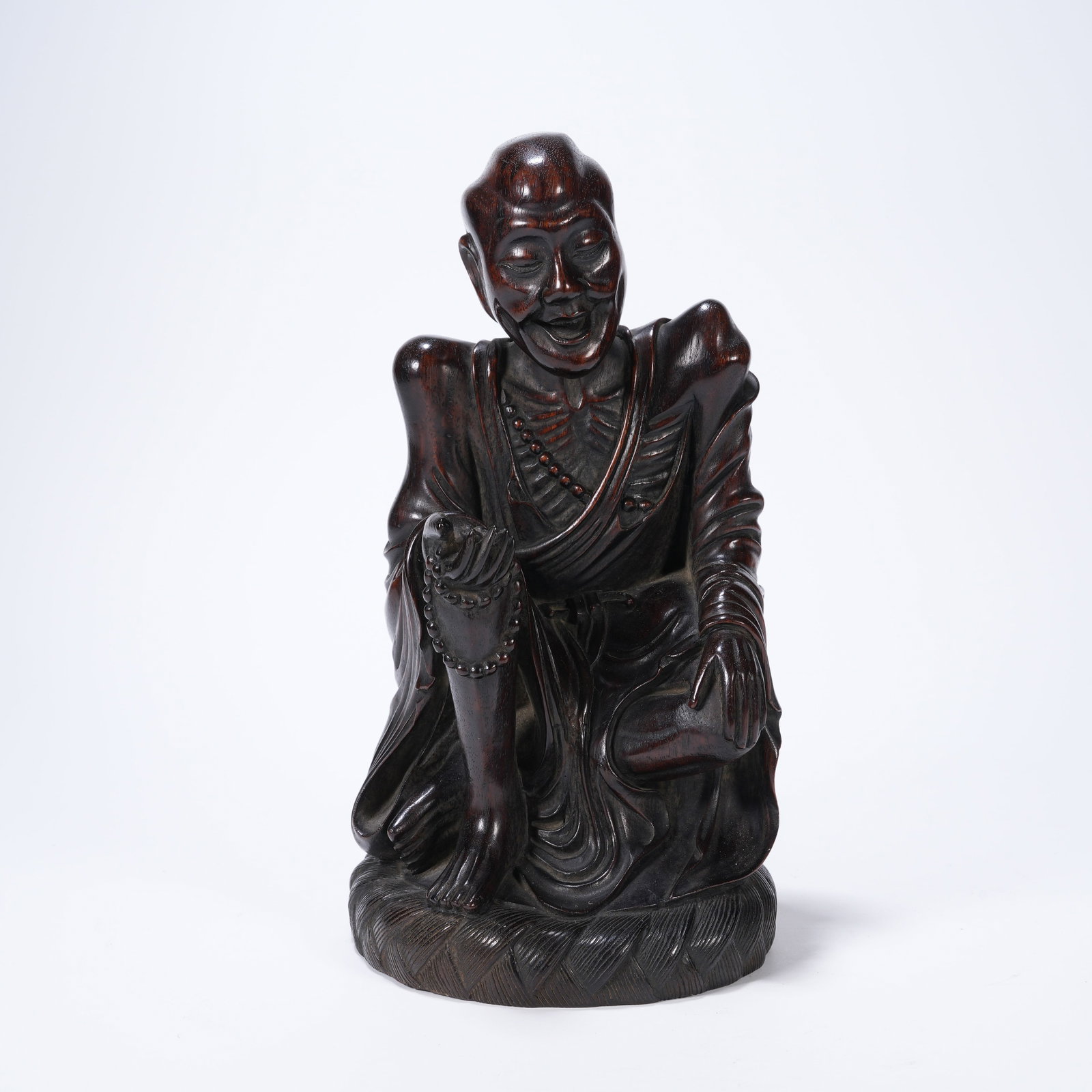 A HUANGHUALI CARVED EMACIATED ARHAT FIGURE (1 of 8)