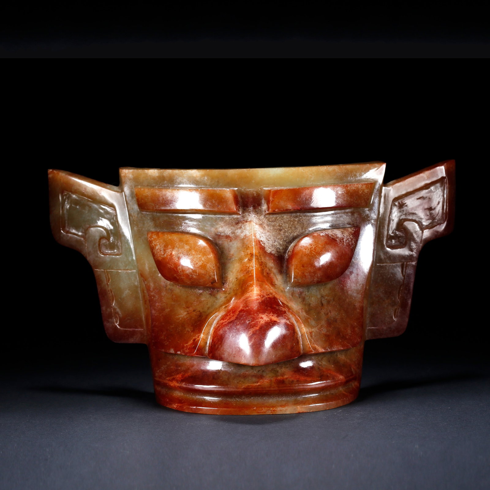 A ARCHAIC JADE HUMAN MASK (1 of 9)