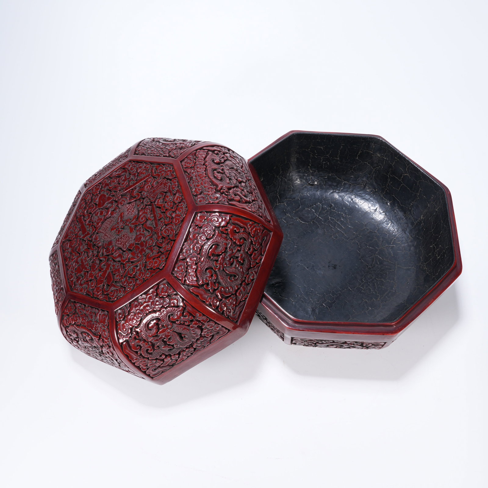A CARVED RED LACQUER COVERED BOX WITH CLOUD?DRAGON PATTERNS (1 of 10)