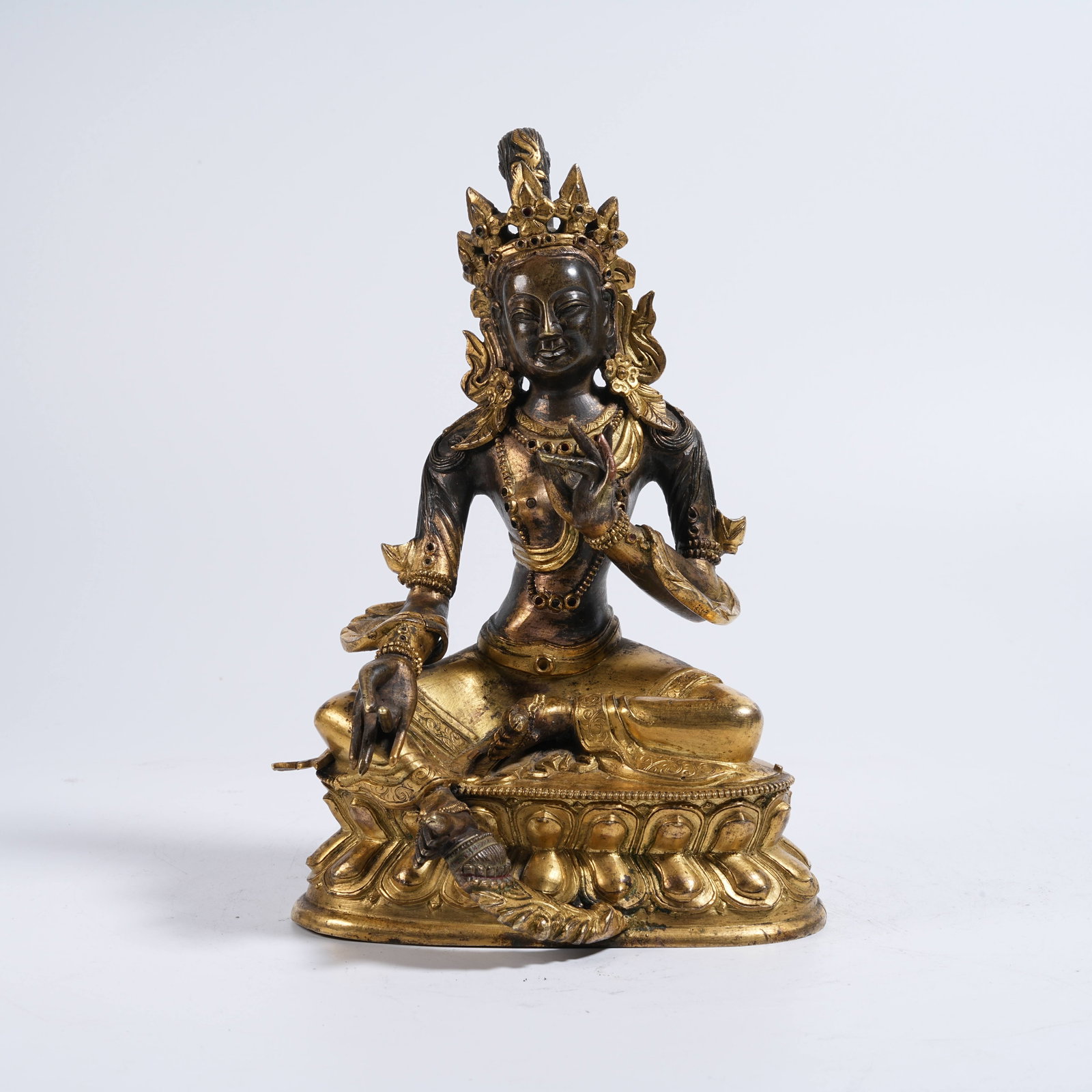 A GILDED BRONZE STATUE OF GREEN TARA: Gilded Bronze Statue of Green Tara