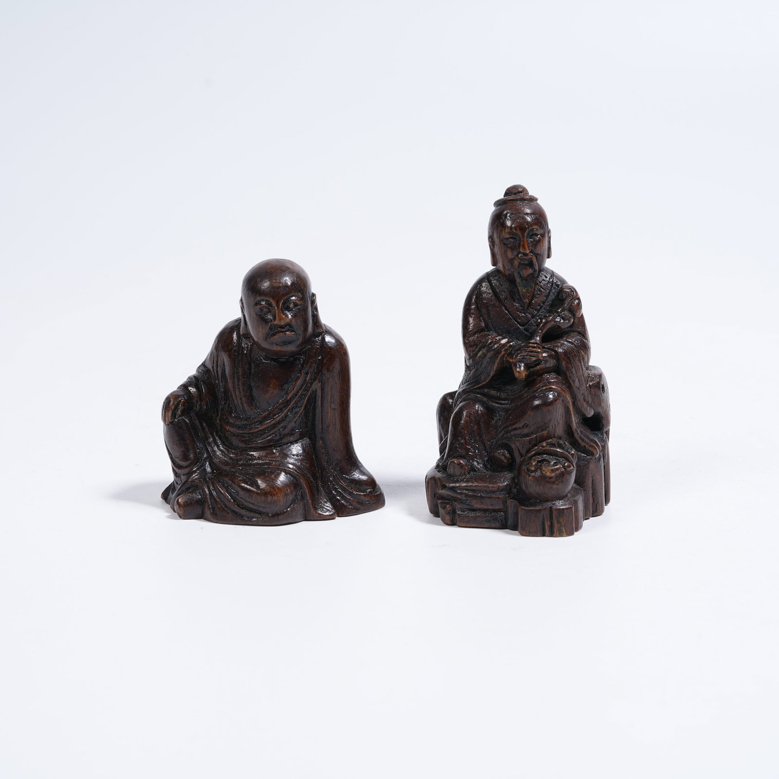 A SET OF QI NAN AGARWOOD FIGURAL ORNAMENTS (1 of 7)