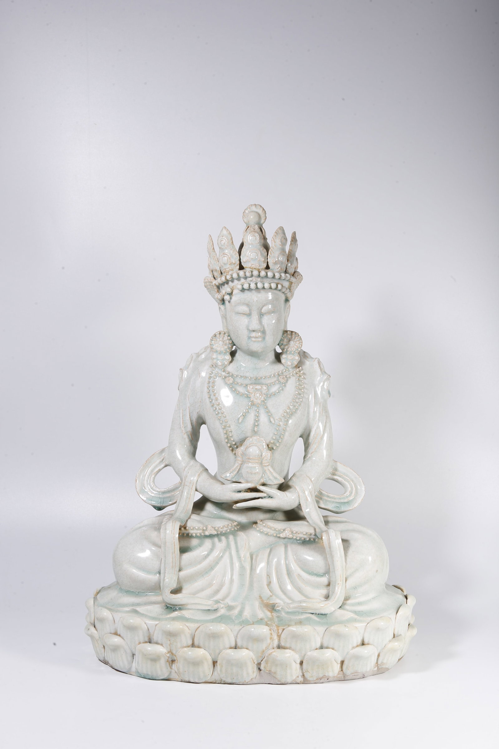 A YINGQING-GLAZED FIGURE OF AMITAYUS BUDDHA: Yingqing-Glazed Figure of Amitayus Buddha