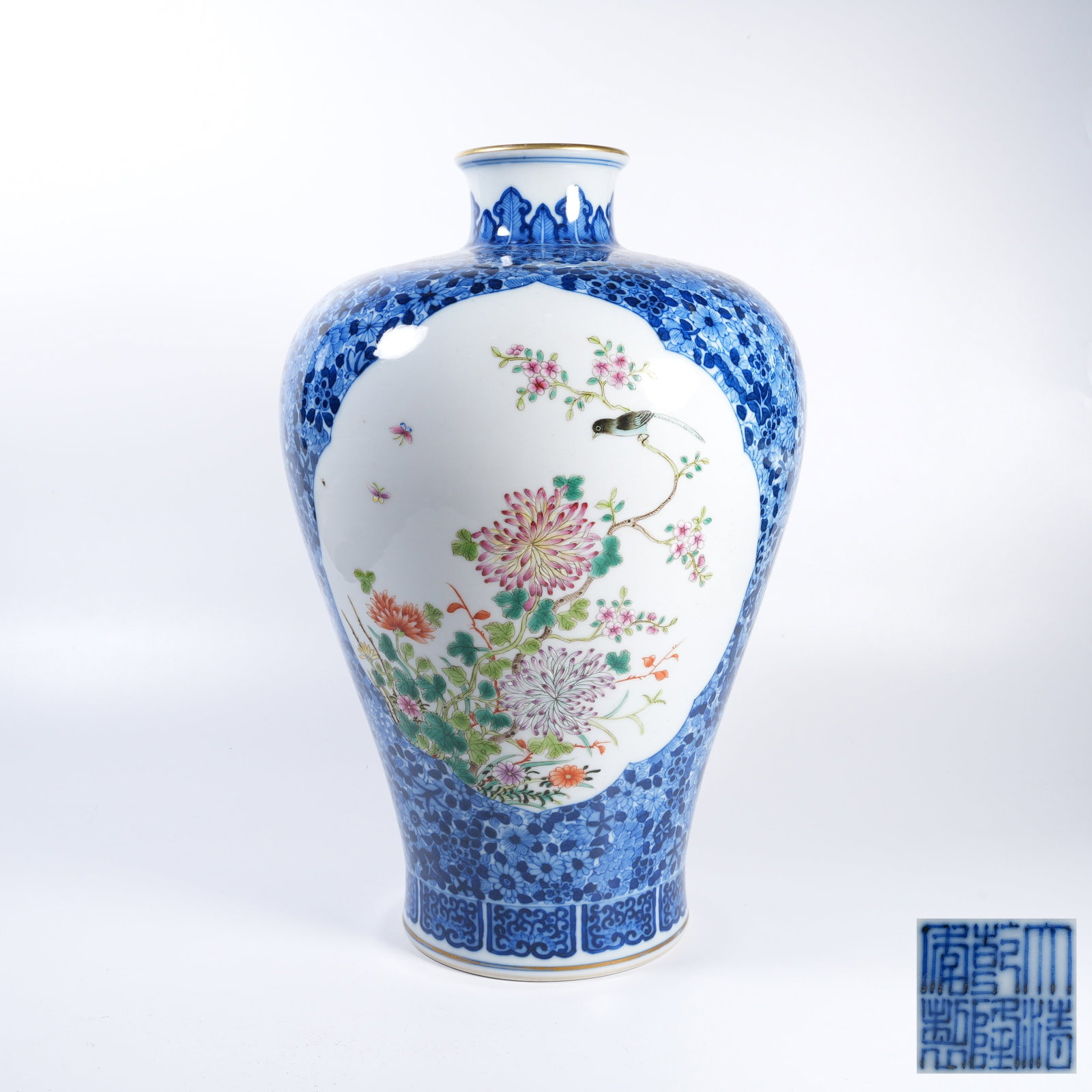 A BLUE AND WHITE PLUM VASE WITH OPEN?WINDOW FAMILLE ROSE FLOWER?AND?BIRD PANELS: Blue and White Plum Vase with Open?Window Famille Rose Flower?and?Bird Panels