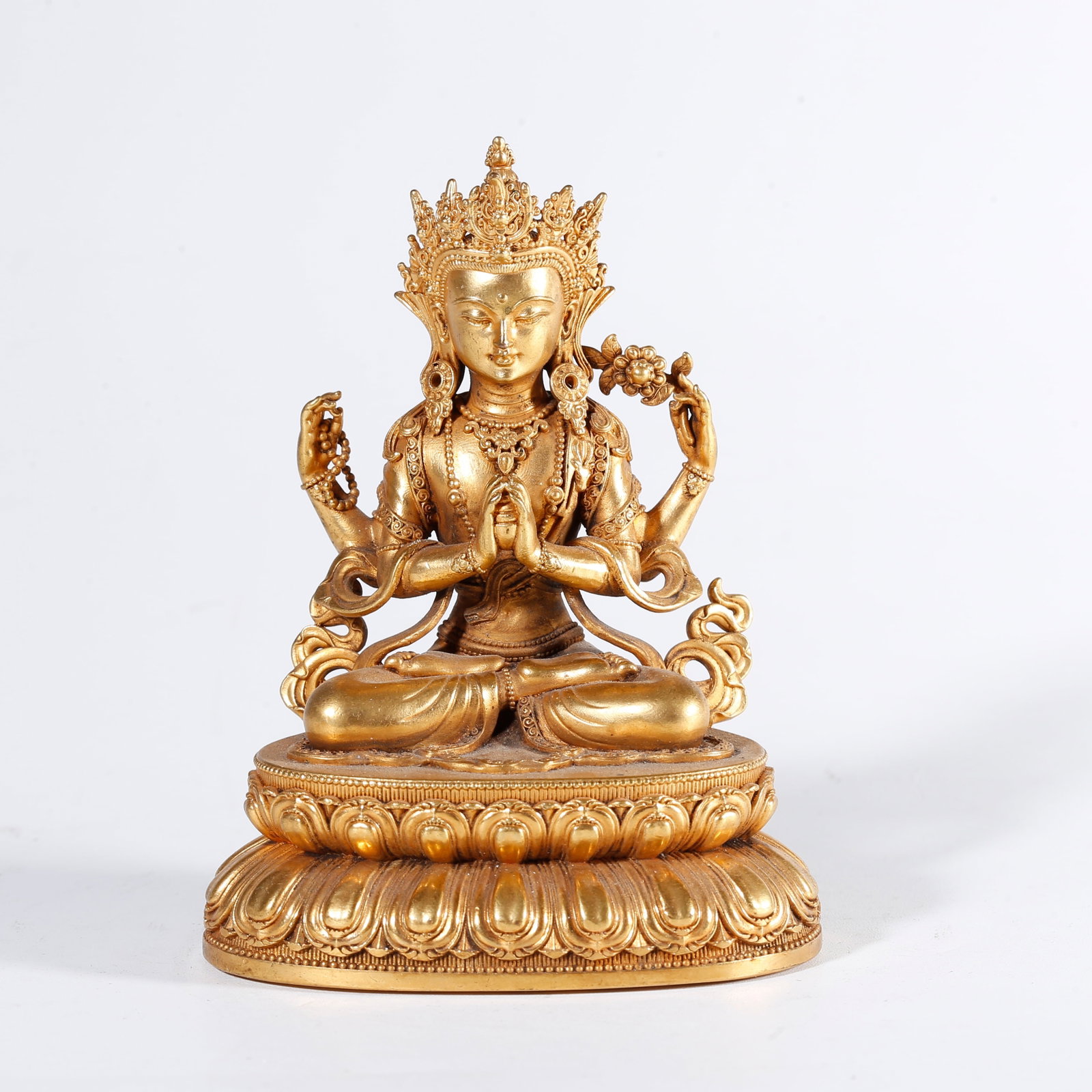 A GILT BRONZE STATUE OF FOUR-ARMED GUANYIN (1 of 9)